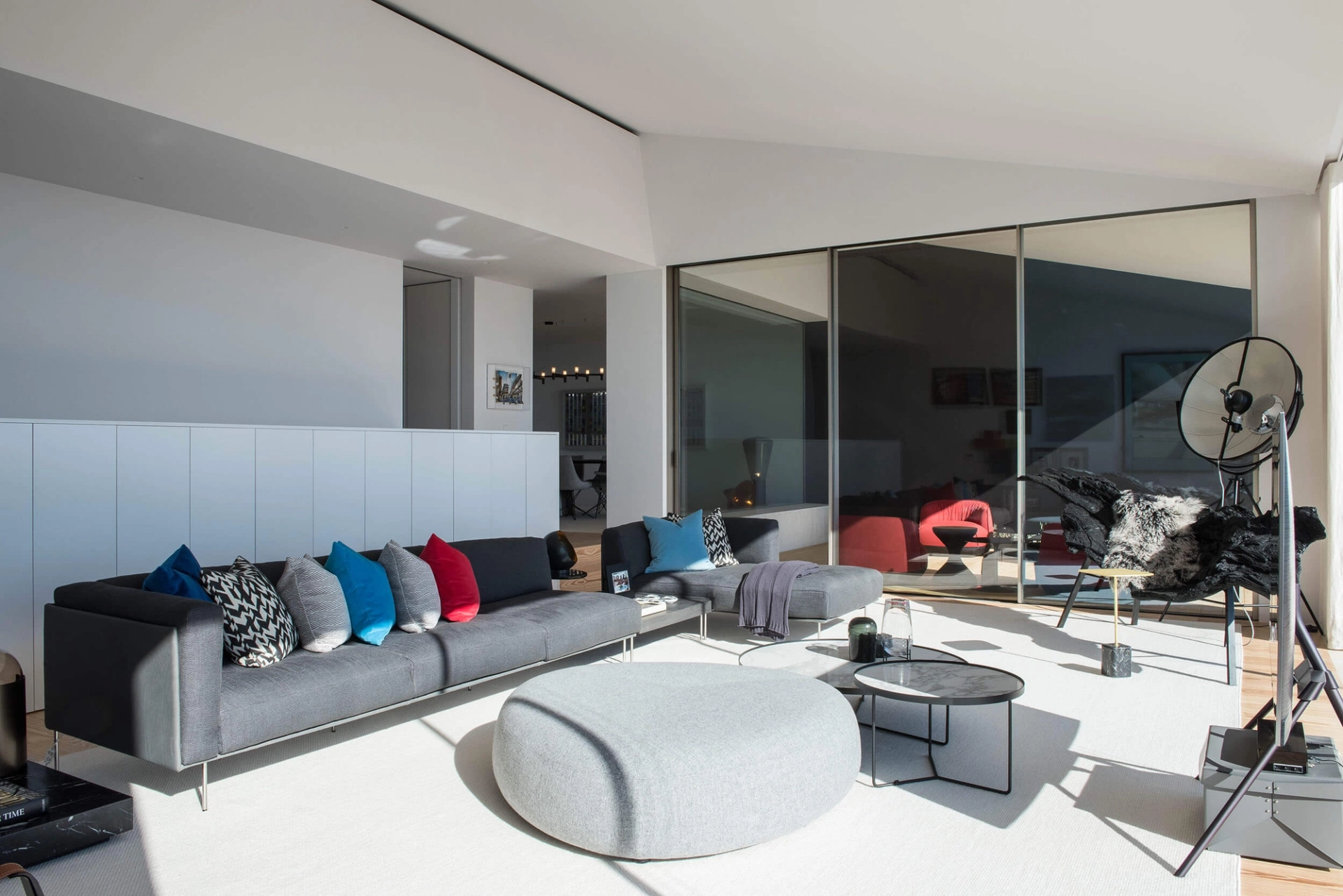 Living room with Living Divani sofa, La Palma Kipu pouf and Palluco Fortuny lamp with Tagus River views — luxury interior design, Lisbon, Atelier Renata Santos Machado