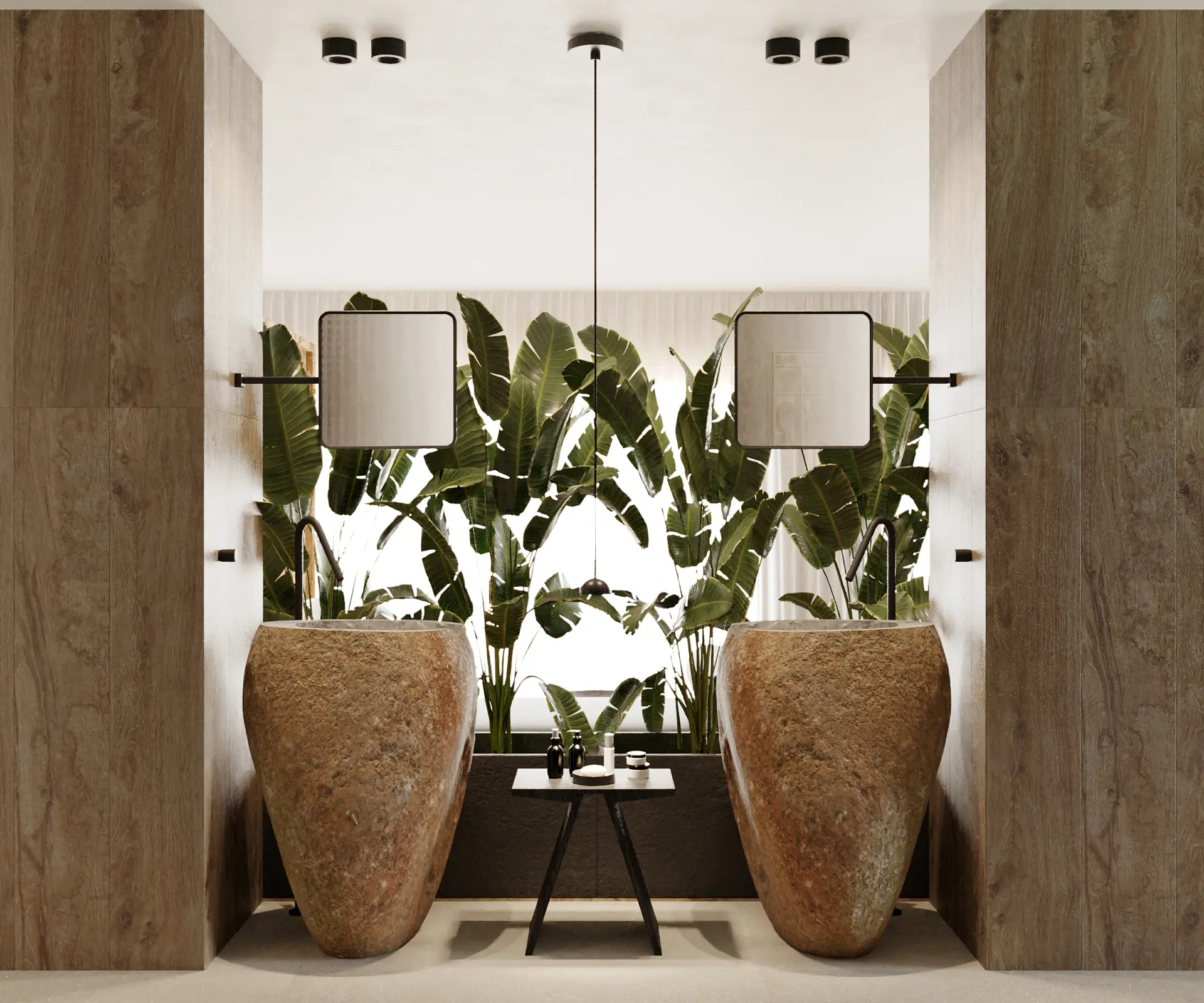 Casa de banho com dois lavatórios escultóricos em pedra, revestimentos naturais, espelhos e plantas de grande dimensão.