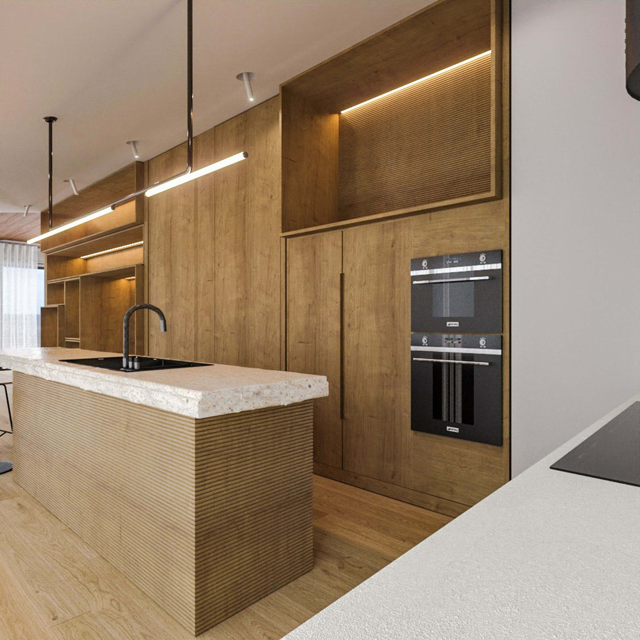 Fluted oak island base, a terrazzo top with a black tap and a column of integrated black ovens — luxury kitchen