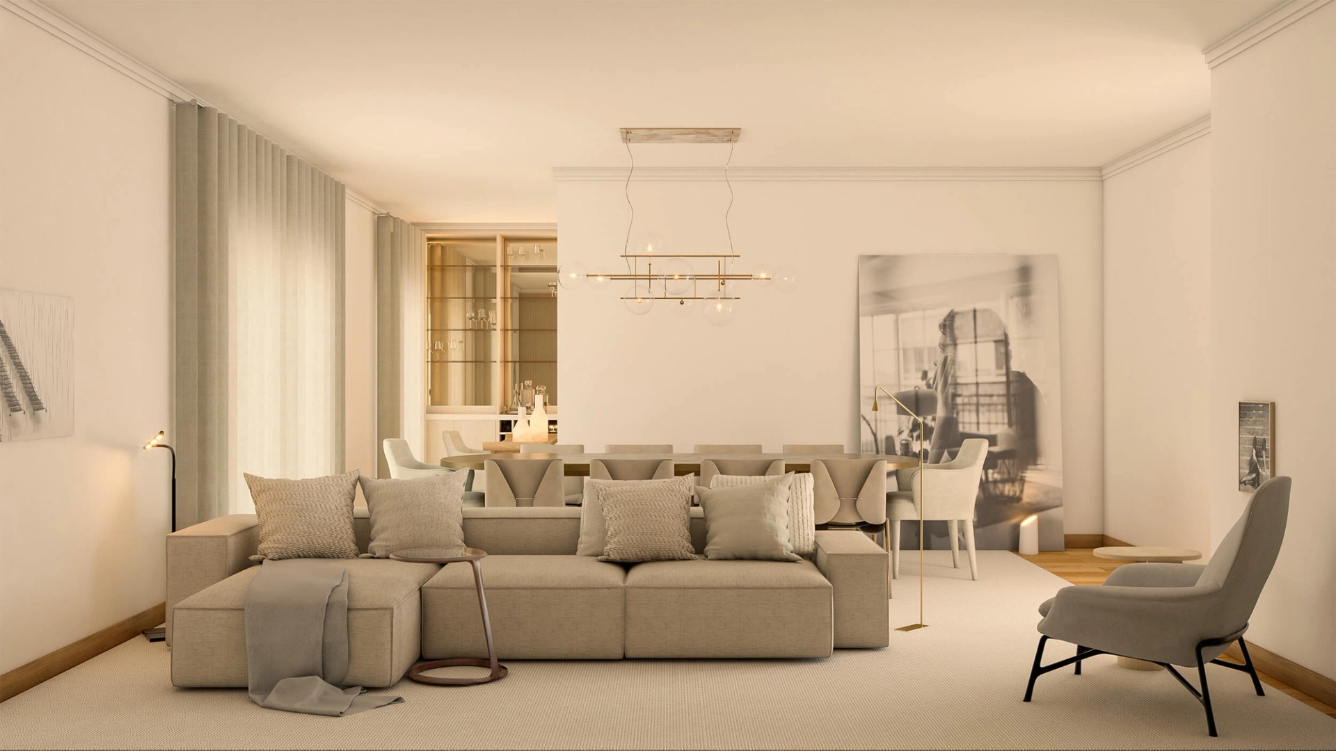 Beige modular linen sofa, brass globe linear chandelier and a large black-and-white photograph by a lounge chair — luxury living room