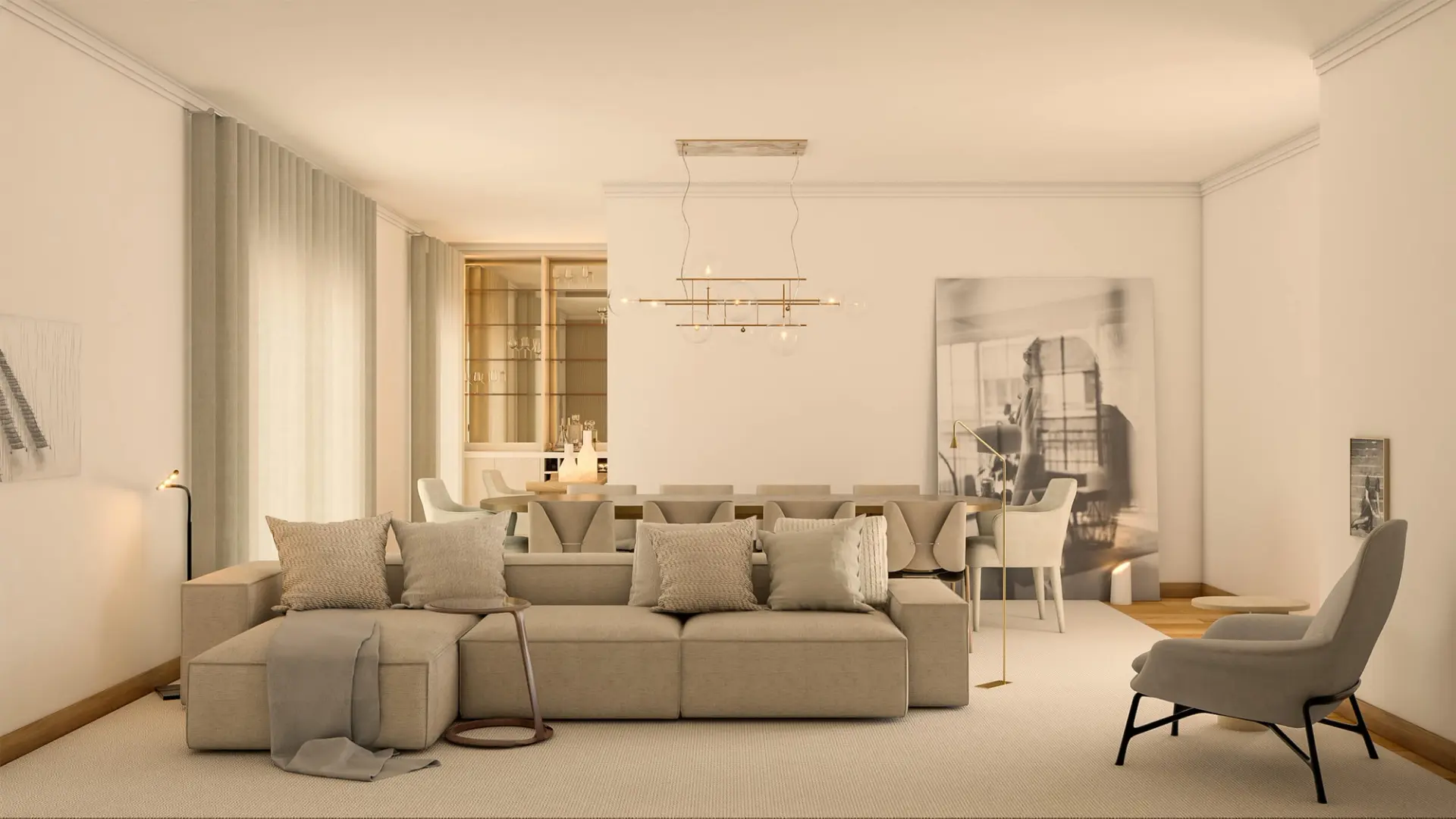 Beige modular linen sofa, brass globe linear chandelier and a large black-and-white photograph by a lounge chair — luxury living room