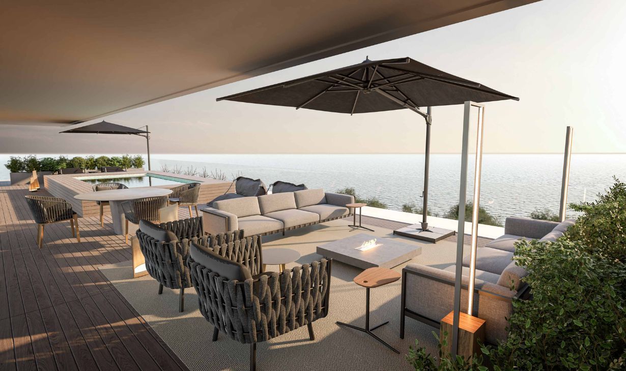 Luxury outdoor living area in Cascais, Portugal with sea views, contemporary lounge furniture and integrated terrace design by Atelier Renata Santos Machado.