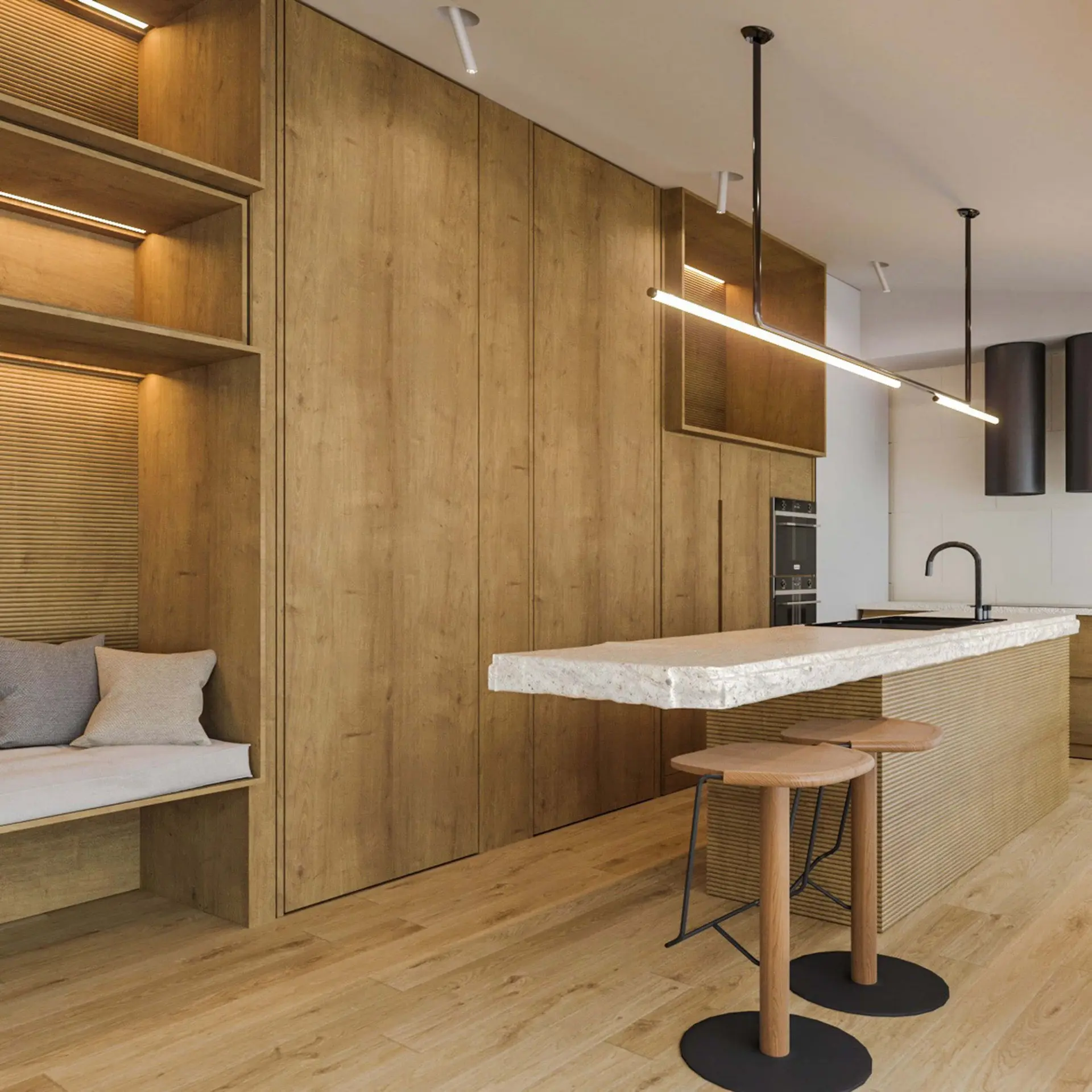Fluted oak island with a terrazzo top, a linear pendant and wood tripod stools beside a reading nook — luxury kitchen