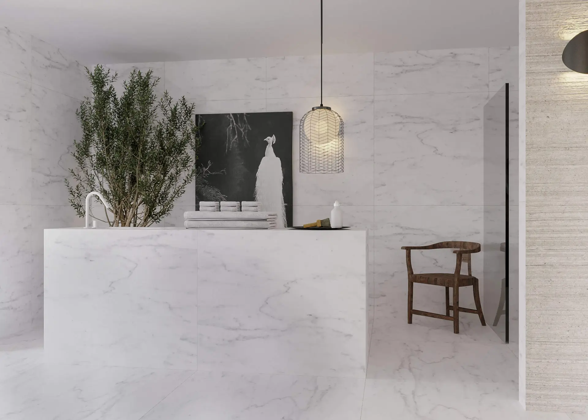 Statuario Carrara marble vanity and wall with a potted olive tree, a wire-cage pendant and a walnut armchair — luxury bathroom