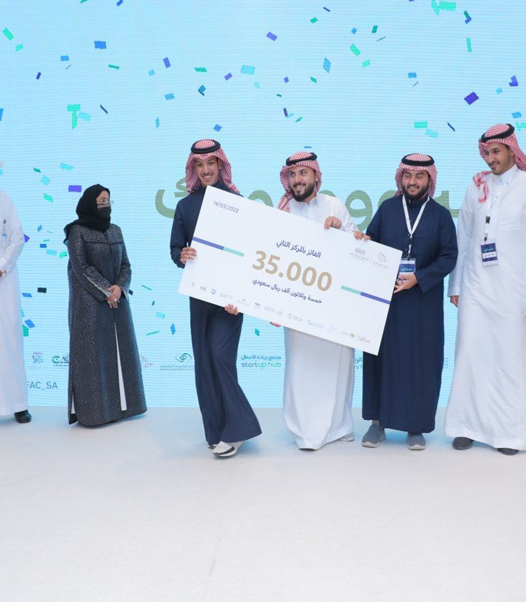 The second-place team receiving their prize at the closing ceremony