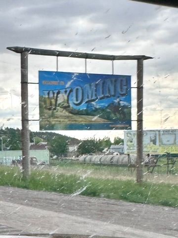 Entering Wyoming as seen through a bug covered window