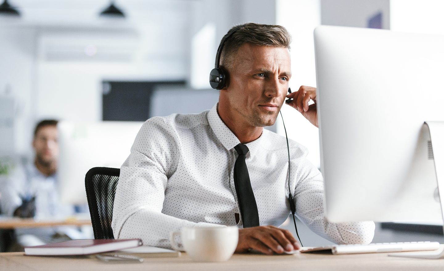 man in callcenter with headset