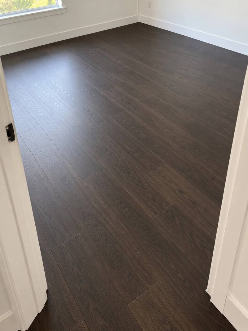 Illustration of Wenge laminate in an empty room