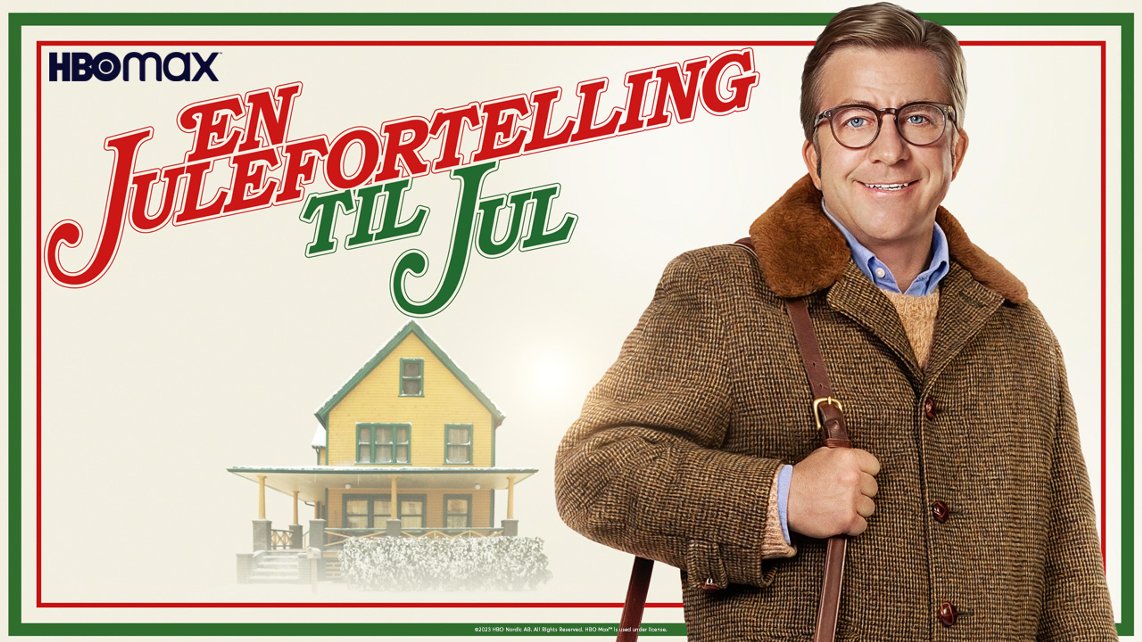 En mann i vinterklær står foran et bittelite gult hus.