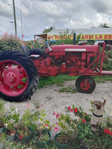Red tractor outside Rubio's Farm La Esperanza stand in Homestead, FL