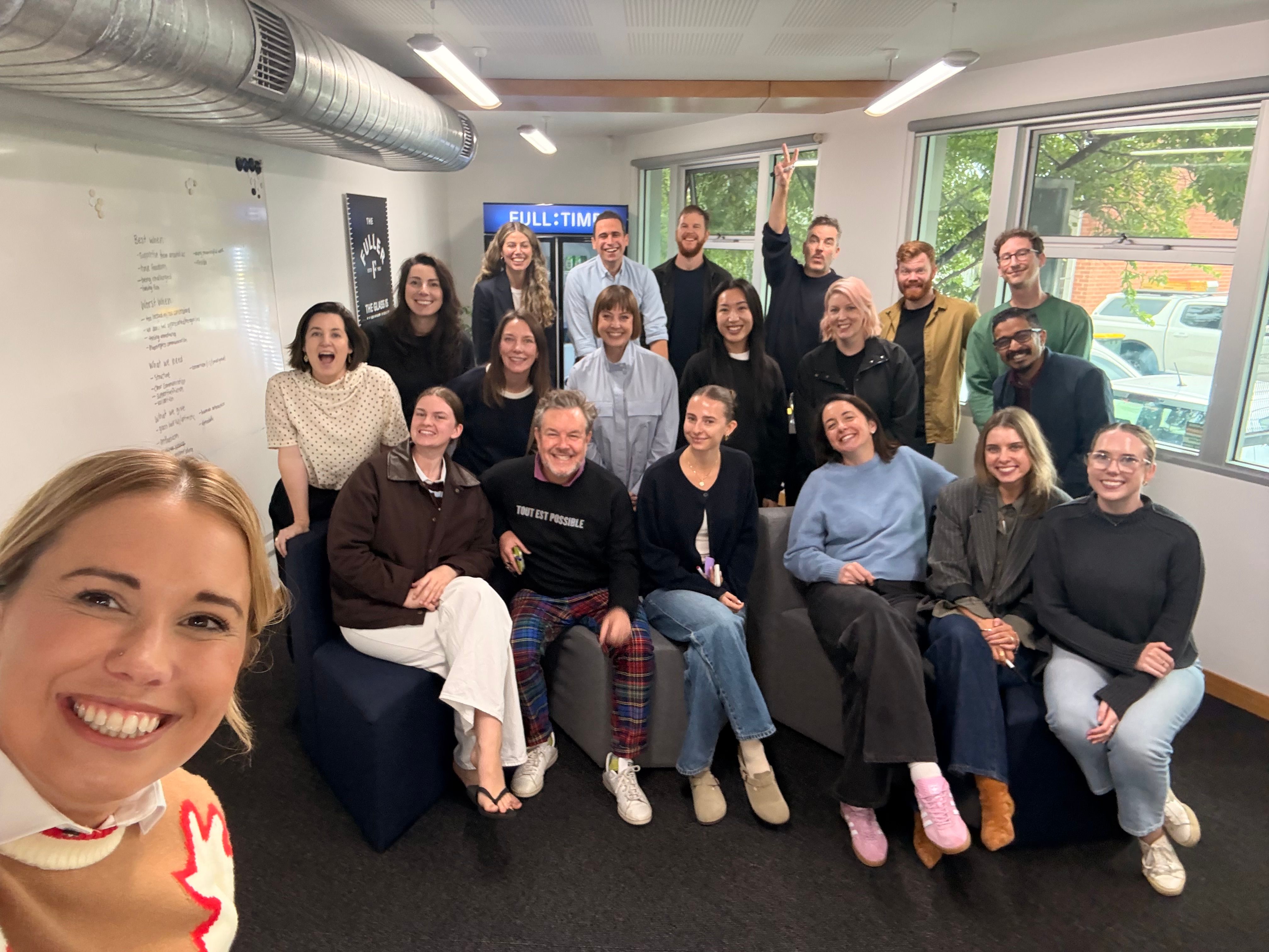 The Fuller team smiling to camera with our HR speaker Thiery for the annual team day