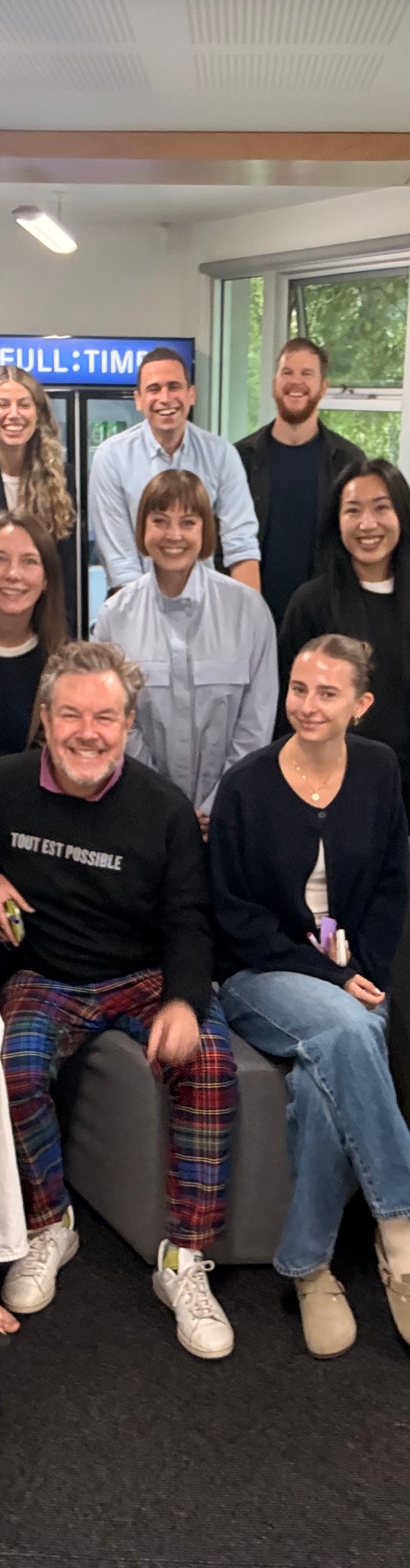 The Fuller team smiling to camera with our HR speaker Thiery for the annual team day