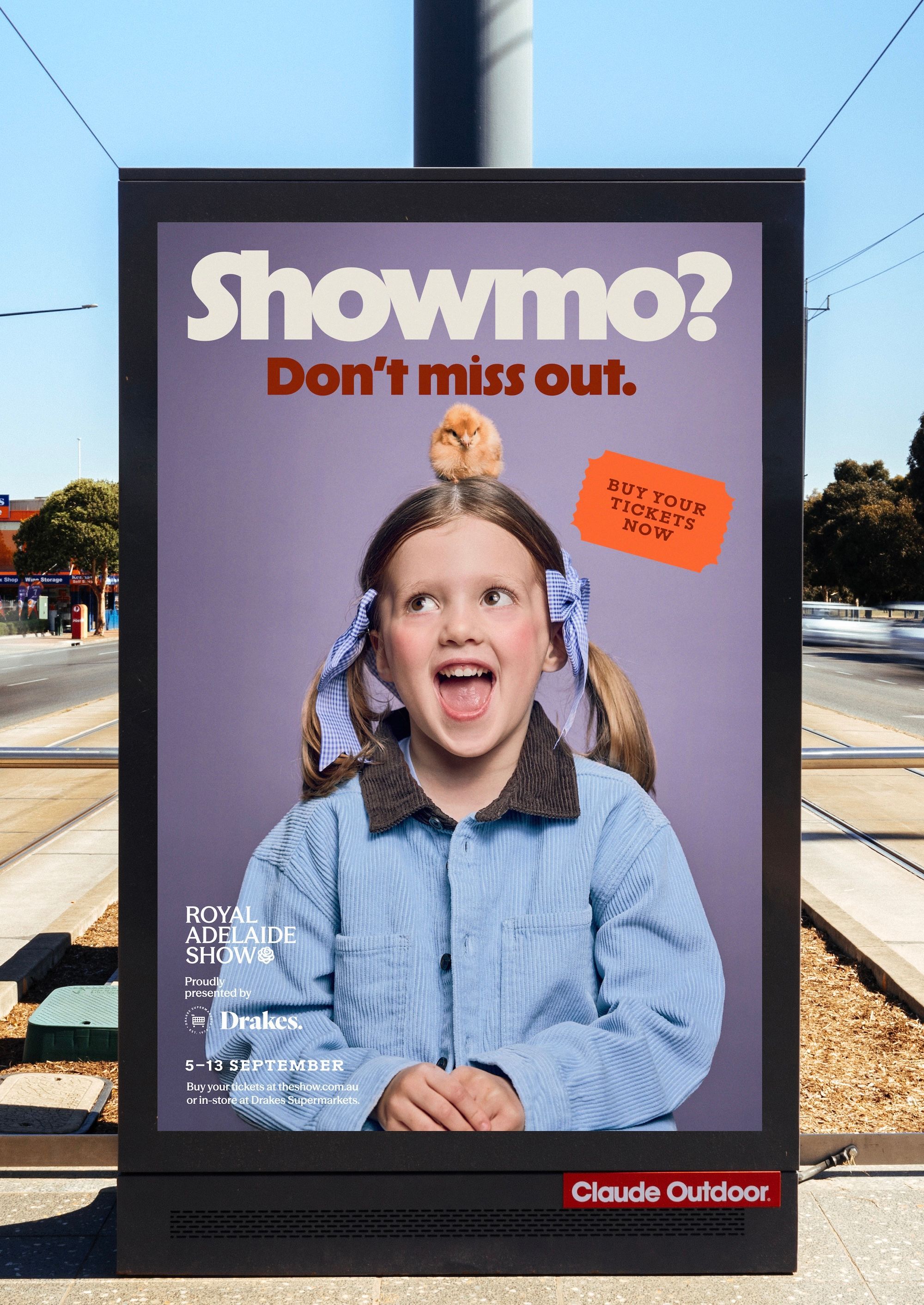 Showmo branding on a tram stop sign
