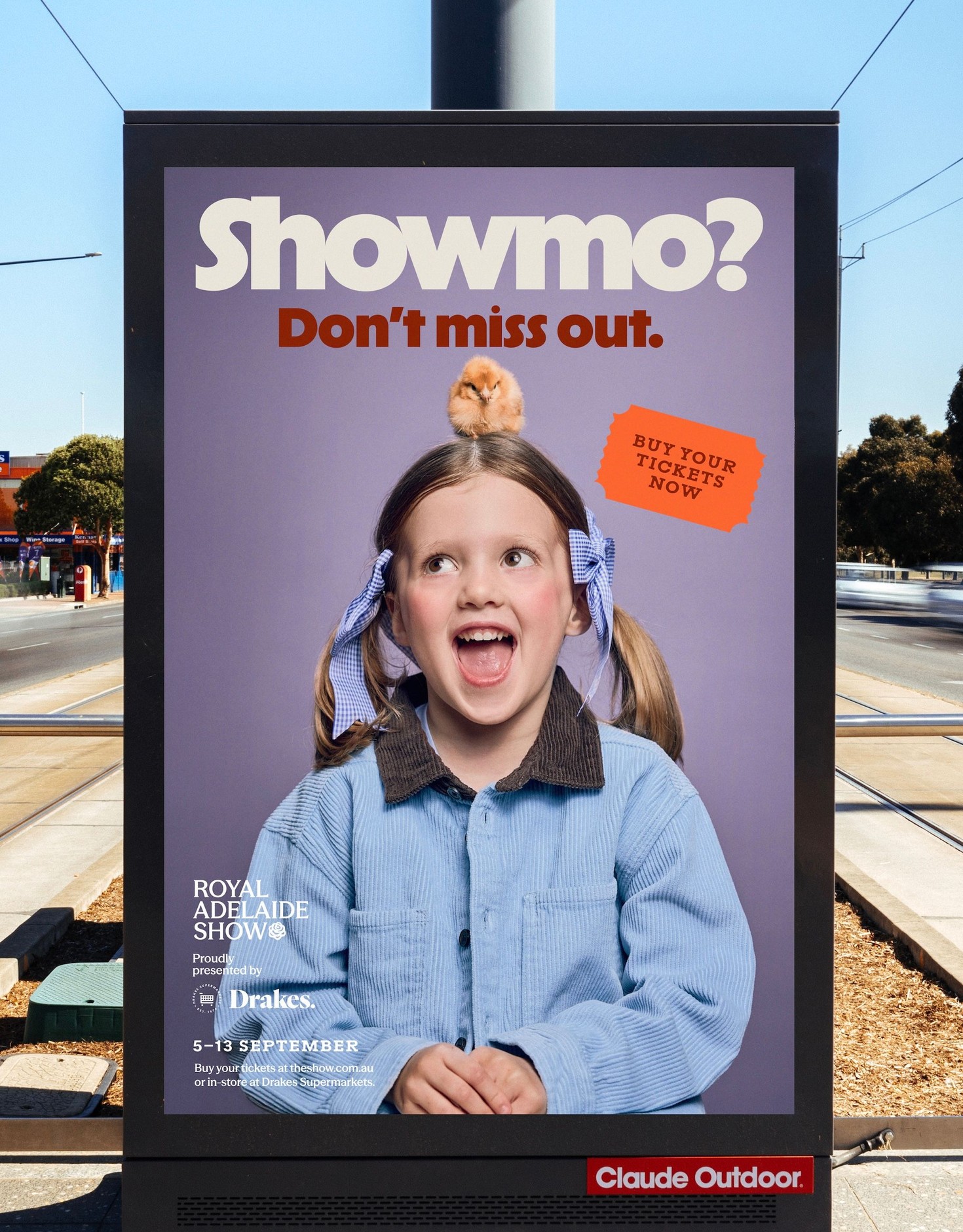 Showmo branding on a tram stop sign