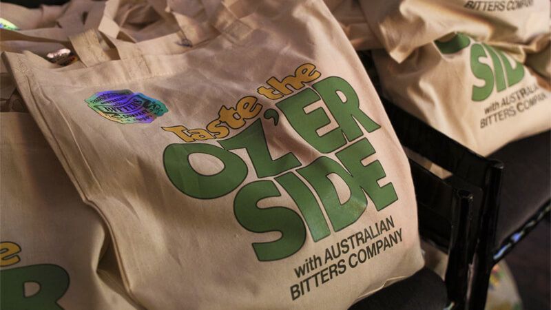 Oz'er side brand on a tote bag