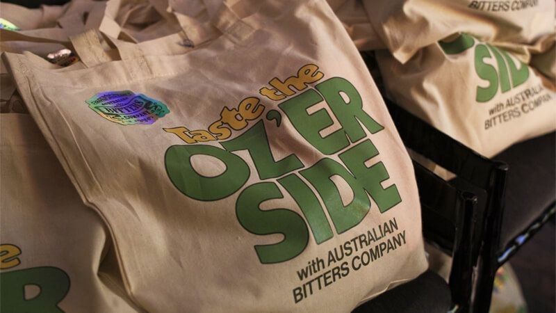 Oz'er side brand on a tote bag