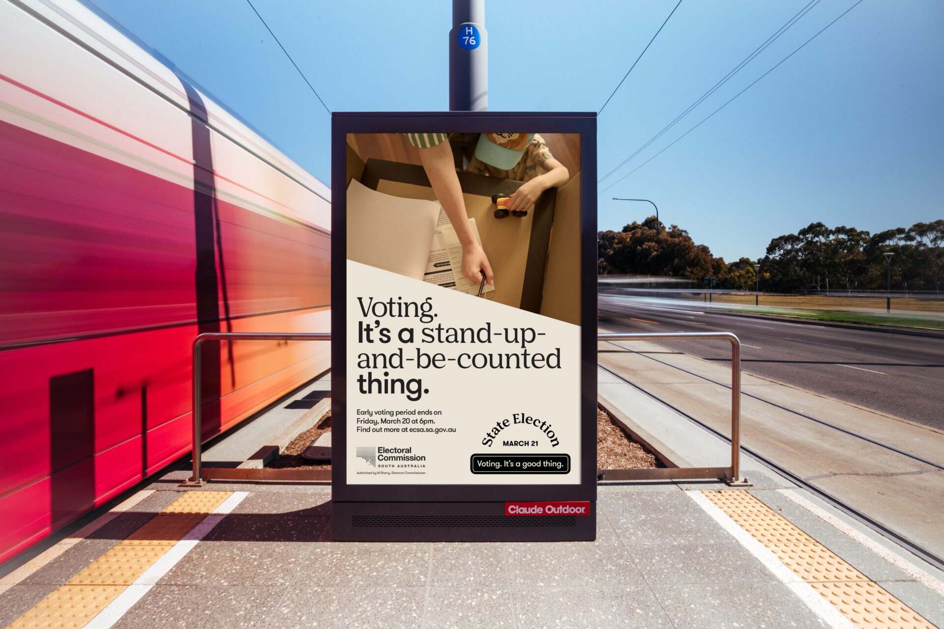 Voting it's a good thing campaign on a light post
