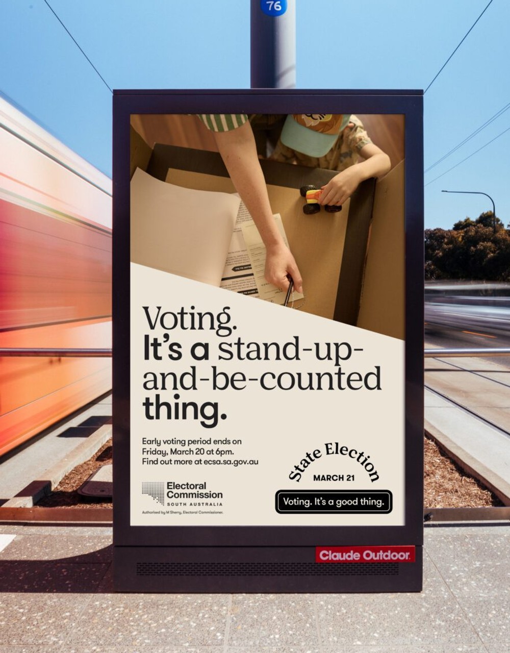 Voting it's a good thing campaign on a light post