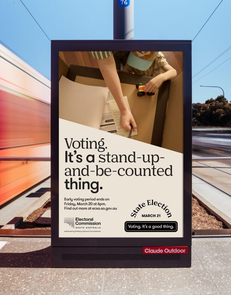 Voting it's a good thing campaign on a light post