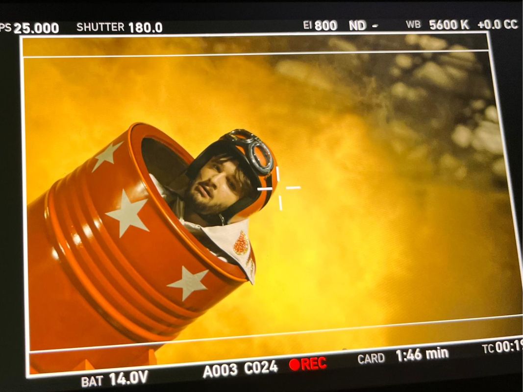 Man in a cannonball on video screen