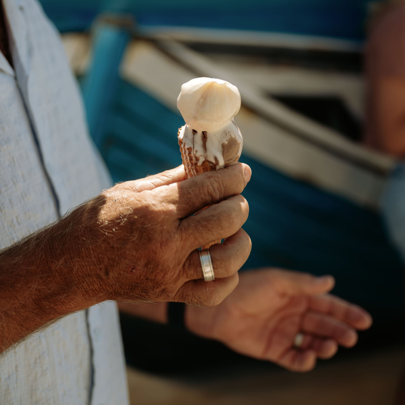 Close-up of a person holding an ice cream during a coastal South Australia experience.