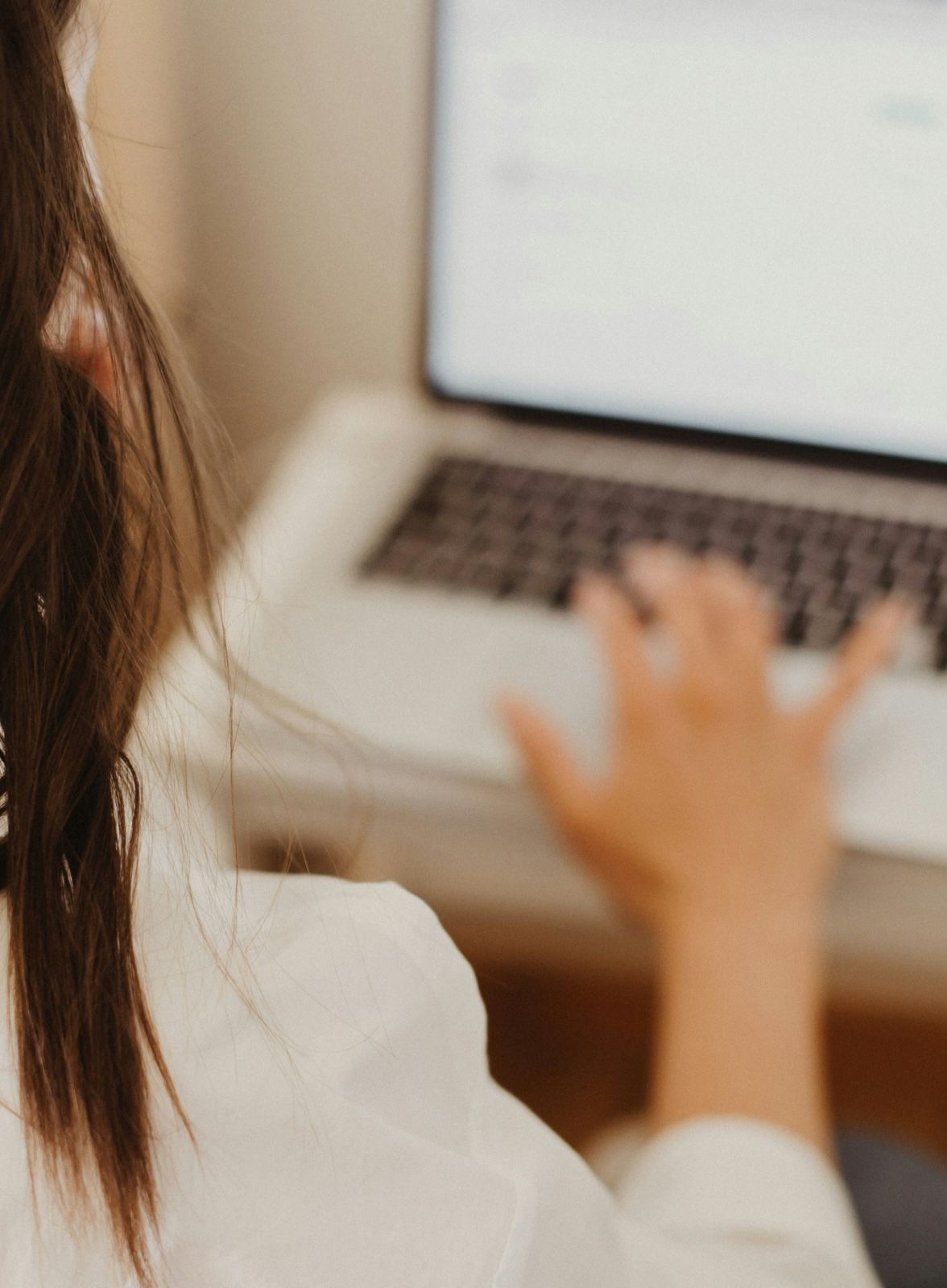 A person typing on a laptop