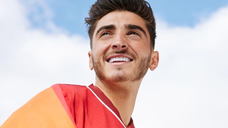 Josh Cavallo smiling for a photo