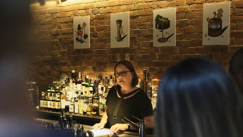 A person behind the bar