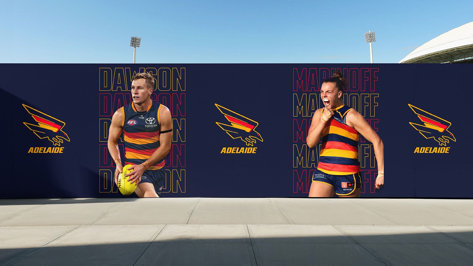 The Adelaide Crows branding and player photography displayed on outdoor signage