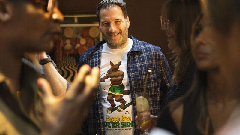 A person wearing Oz'er side brand on a tshirt