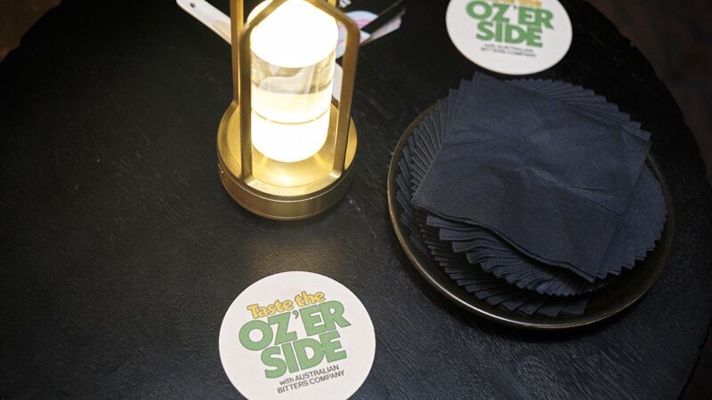 Oz'er side brand on a coaster