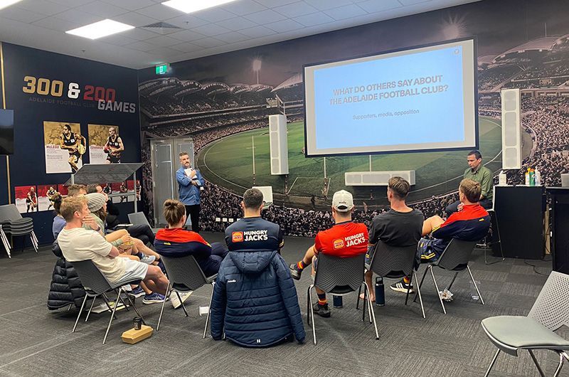 Adelaide Crows players engaged in a brand discovery workshop