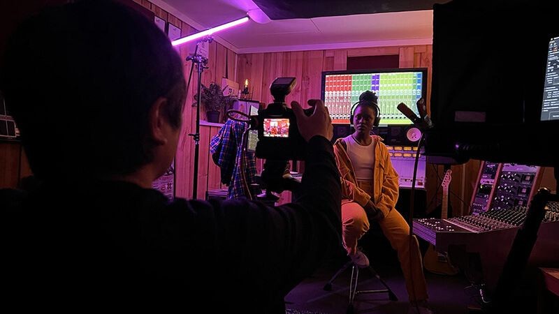 People being filmed on a set for New State of mind