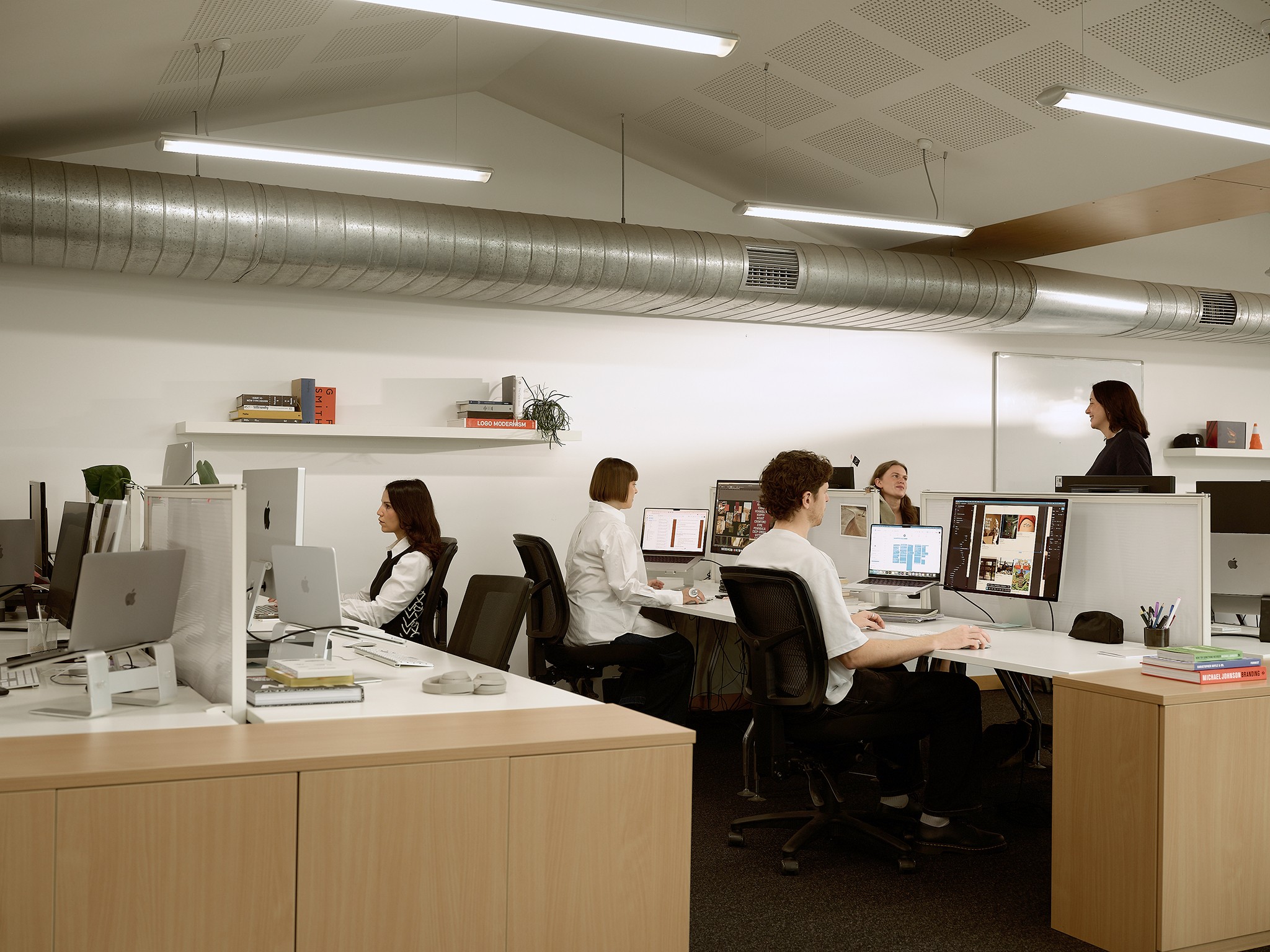 The fuller team working in the upstairs open office