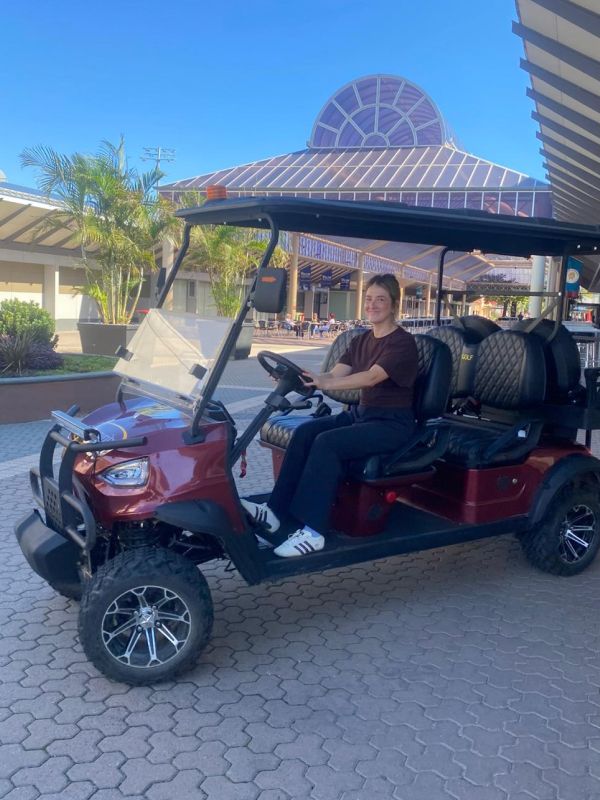 BTS Golf Cart and person driving