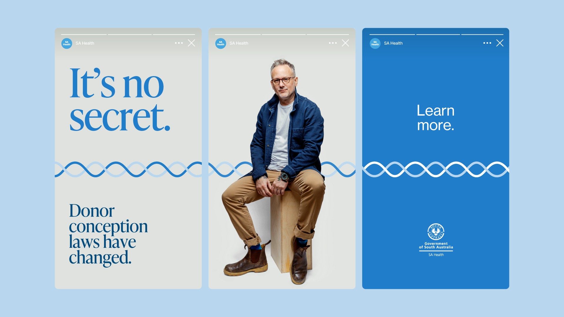 Three consecutive social media story slides from SA Health regarding donor conception laws: First slide: Light grey background featuring blue text reading "It's no secret. Donor conception laws have changed." with a blue double wave line design pattern running across the middle. Second slide: Light grey background showing a person wearing glasses, a blue overshirt, white t-shirt, beige chinos, and brown leather Blundstone boots sitting on a wooden block, with the blue wave line continuing across the center. Third slide: Solid blue background with white text reading "Learn more." above a white wave line pattern, with the Government of South Australia SA Health logo displayed at the bottom
