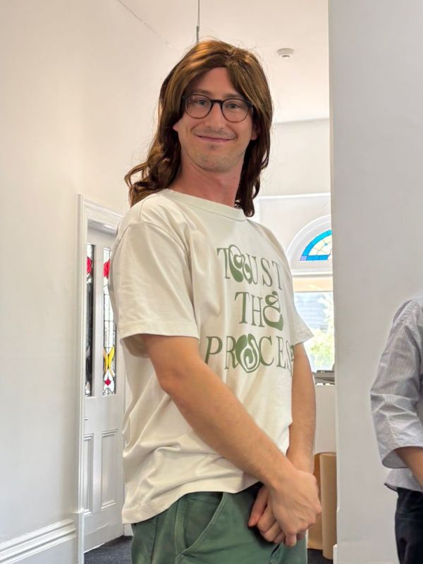 Todd wearing a wig in the Fuller office