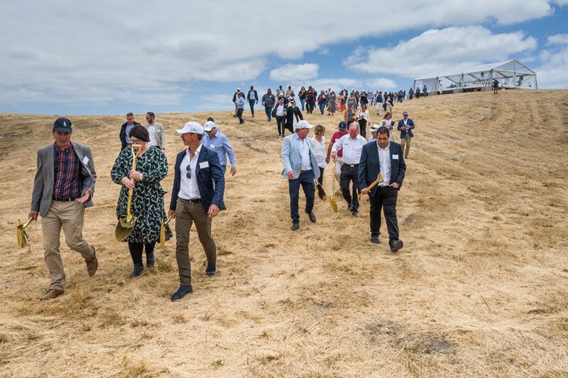 Guests walking across the coastal landscape during The Cliffs Kangaroo Island launch event.