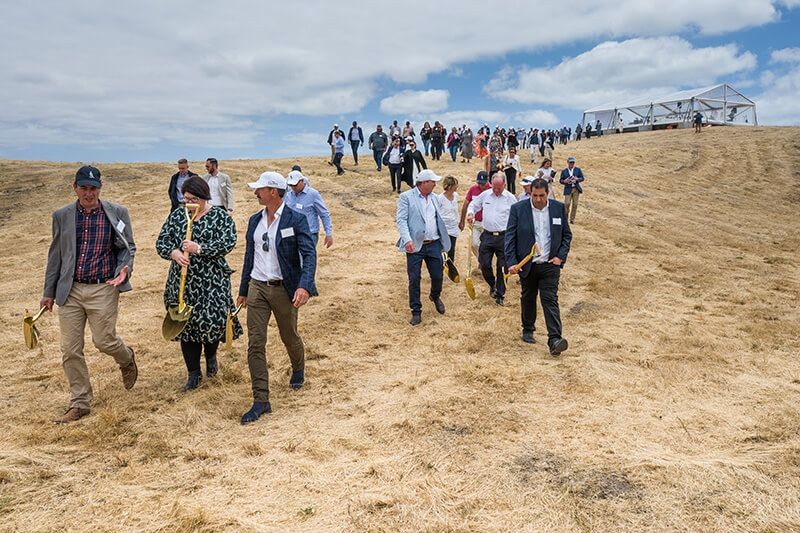 Guests walking across the coastal landscape during The Cliffs Kangaroo Island launch event.