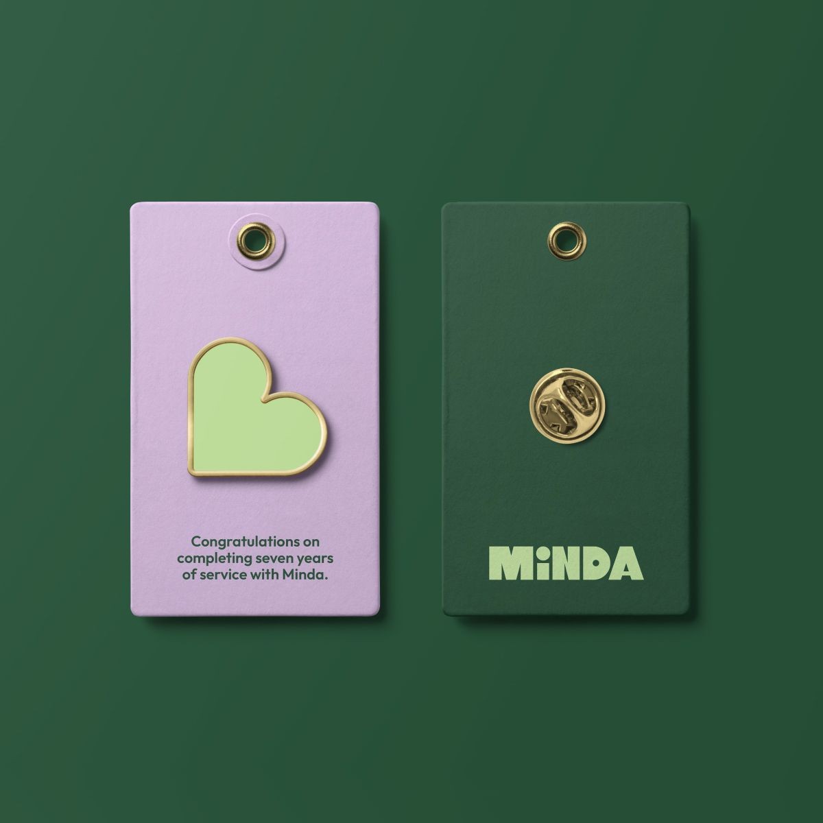 Minda branded tags featuring the green and lilac visual identity.