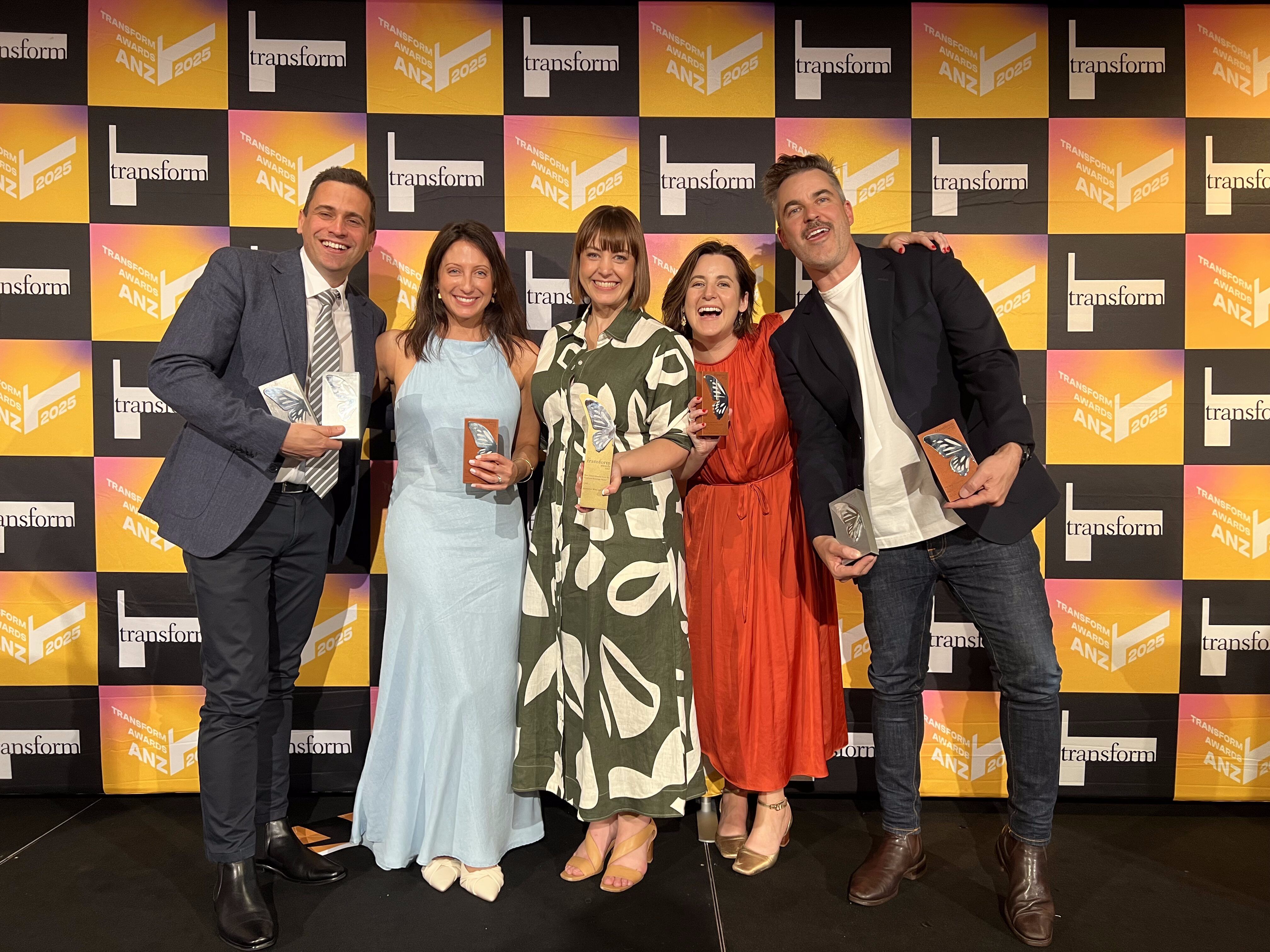 Fuller team photo holding awards fron Transform