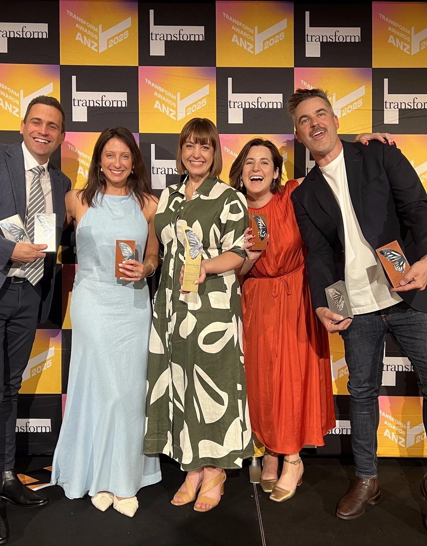 Fuller team photo holding awards fron Transform