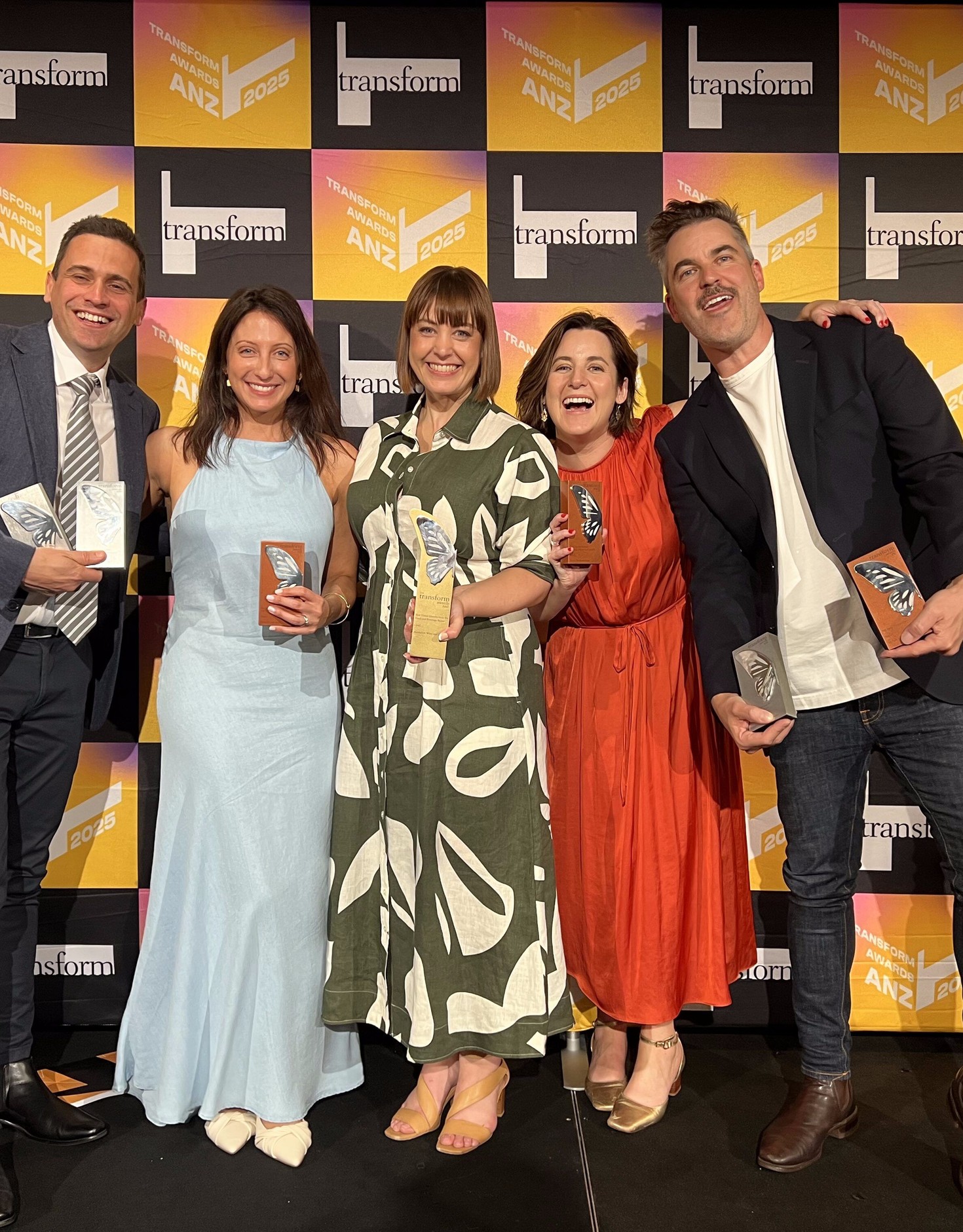 Fuller team photo holding awards fron Transform