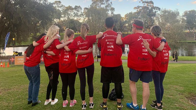 The fuller team wearing their red Fuller Fit t-shirts