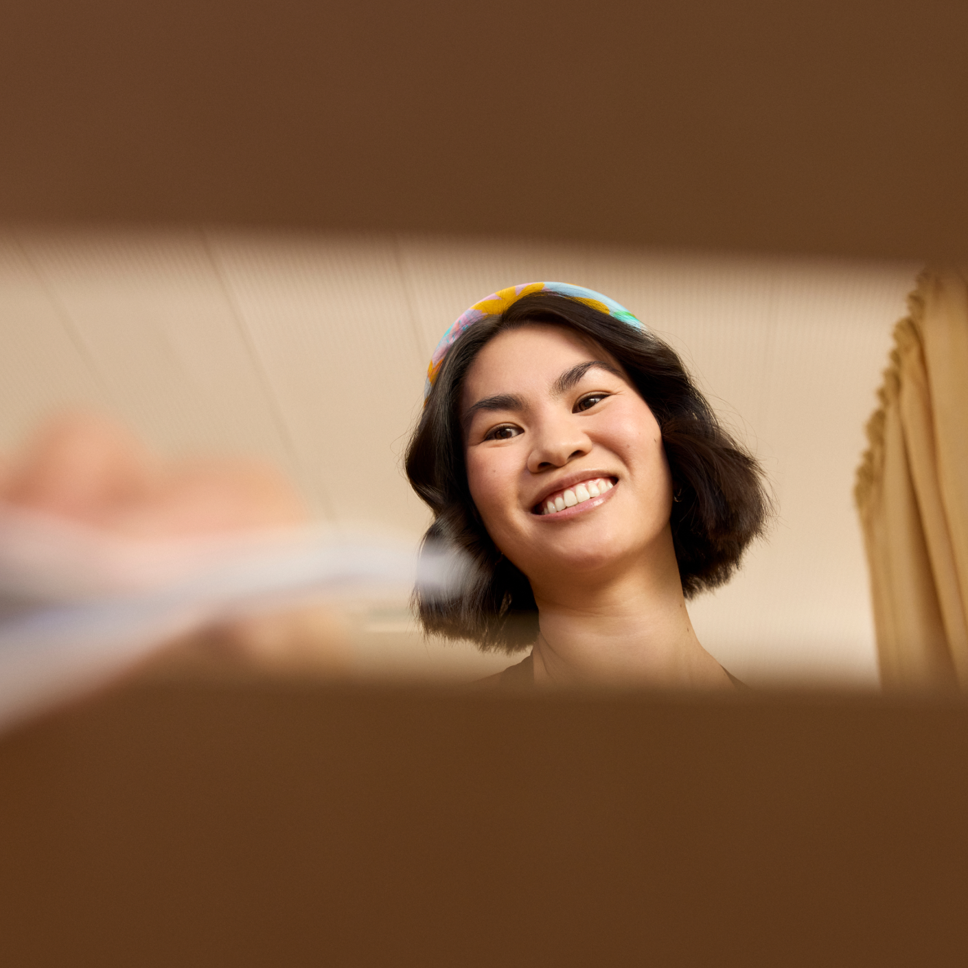 a person placing their vote into a box