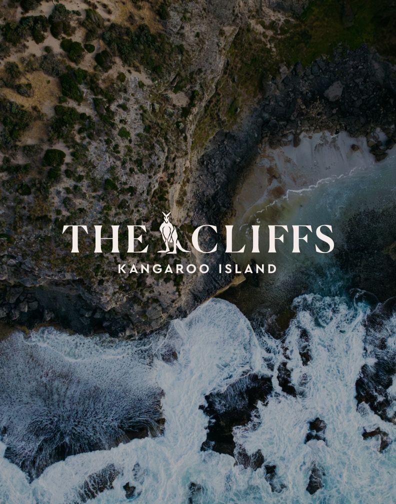 The Cliffs Kangaroo Island branding over an aerial view of the rugged coastline.