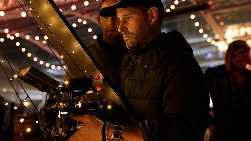 The camera operators reviewing the screen on a film set
