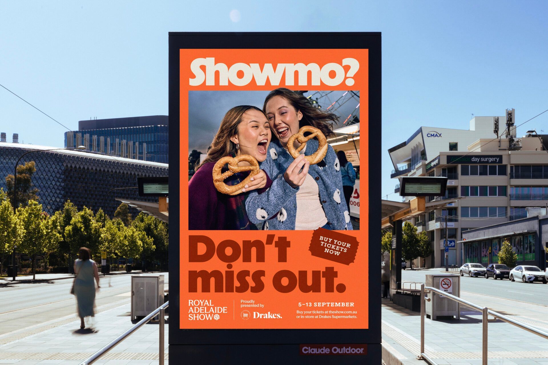 Showmo branding on a tram stop sign