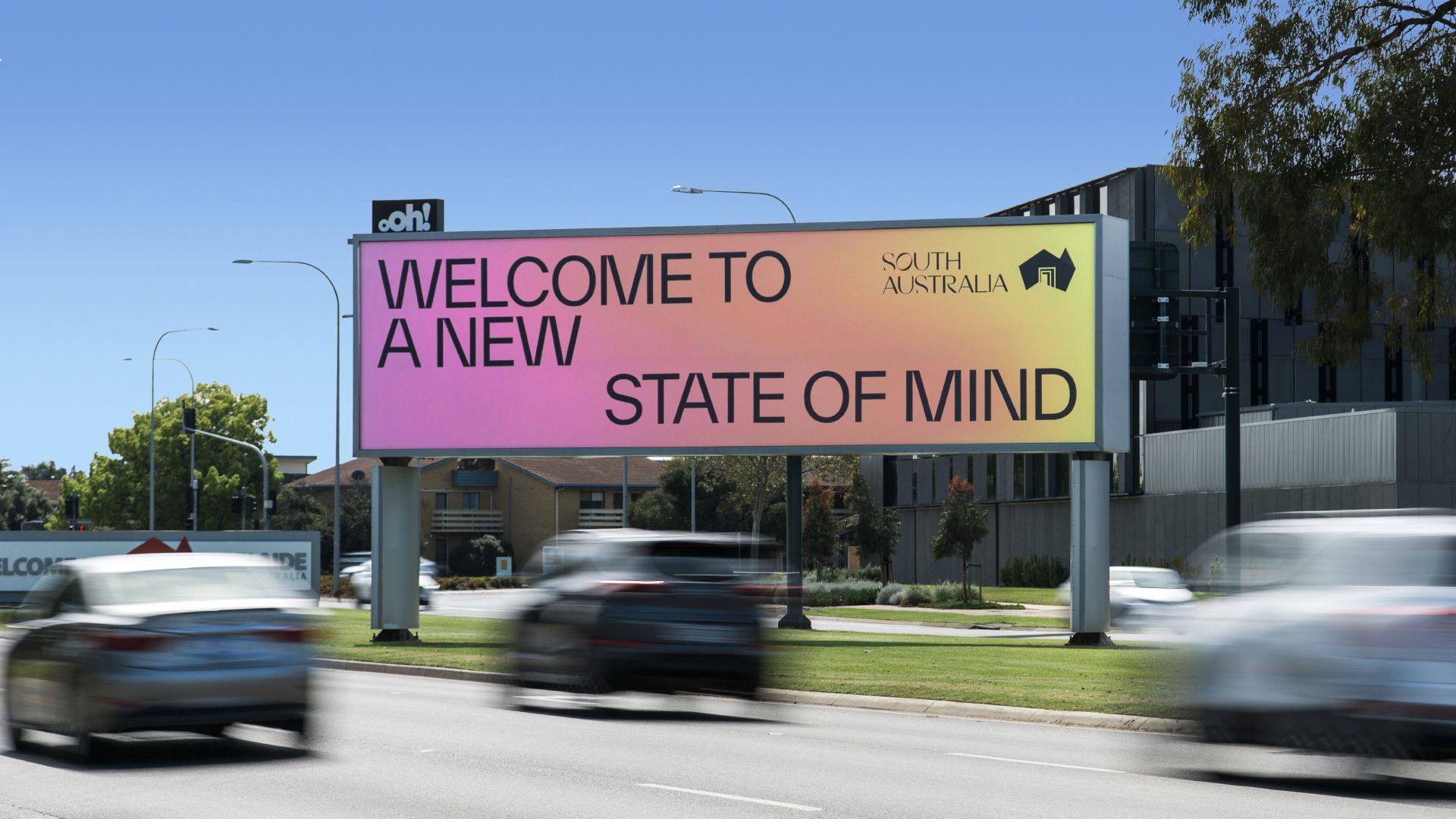 A biilboard on a street with the new state of mind brand