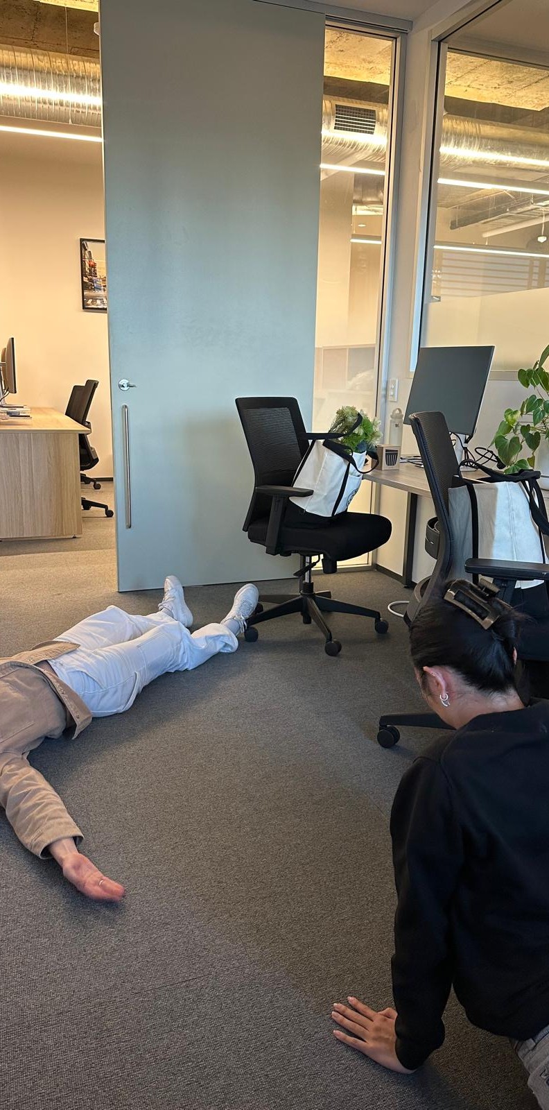 Bianka and Raph our Sydney Account Managers laying on the office floor after a long day